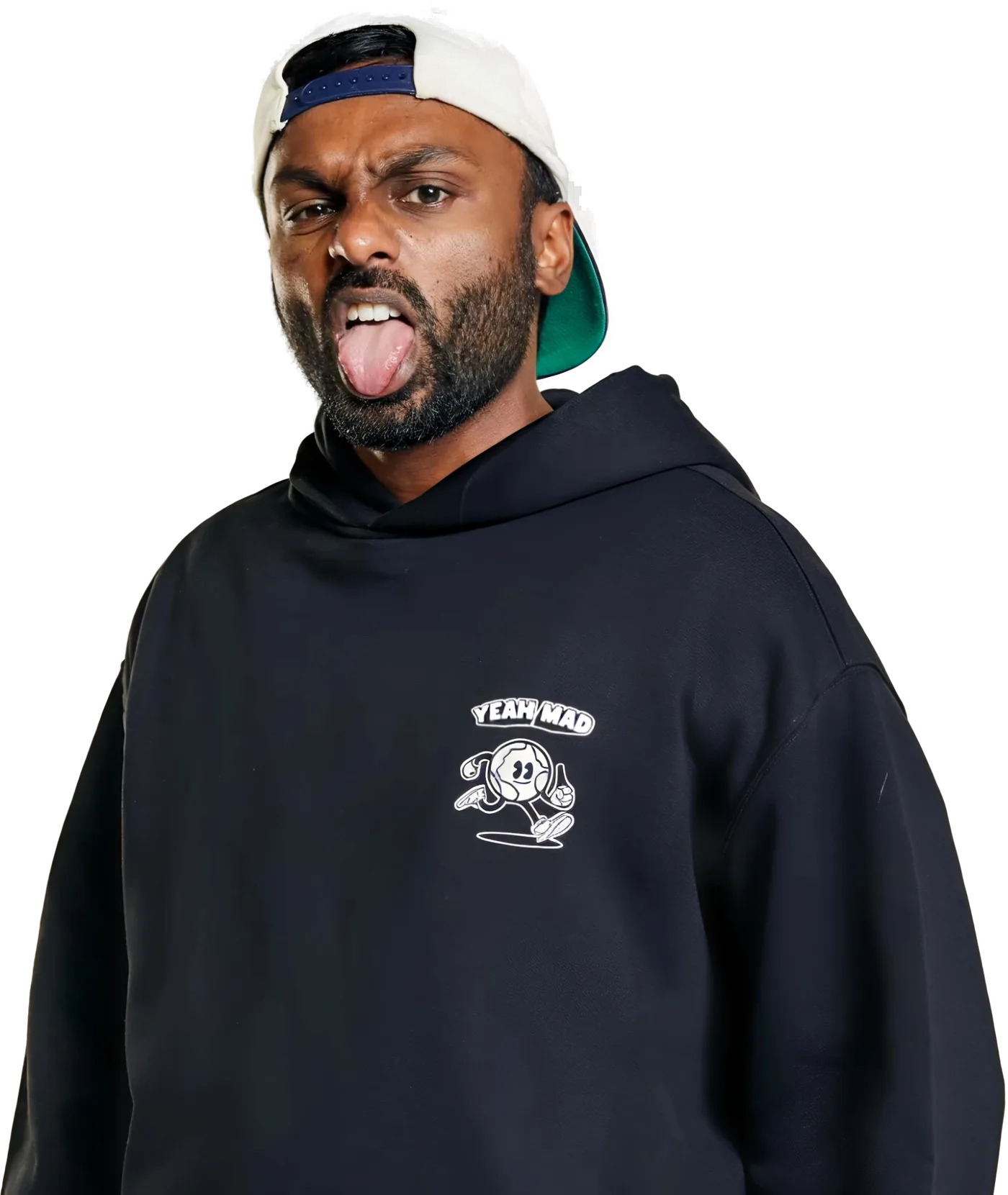 Sath Nadesan in a Yeah Mad hoodie and backwards cap, tongue out